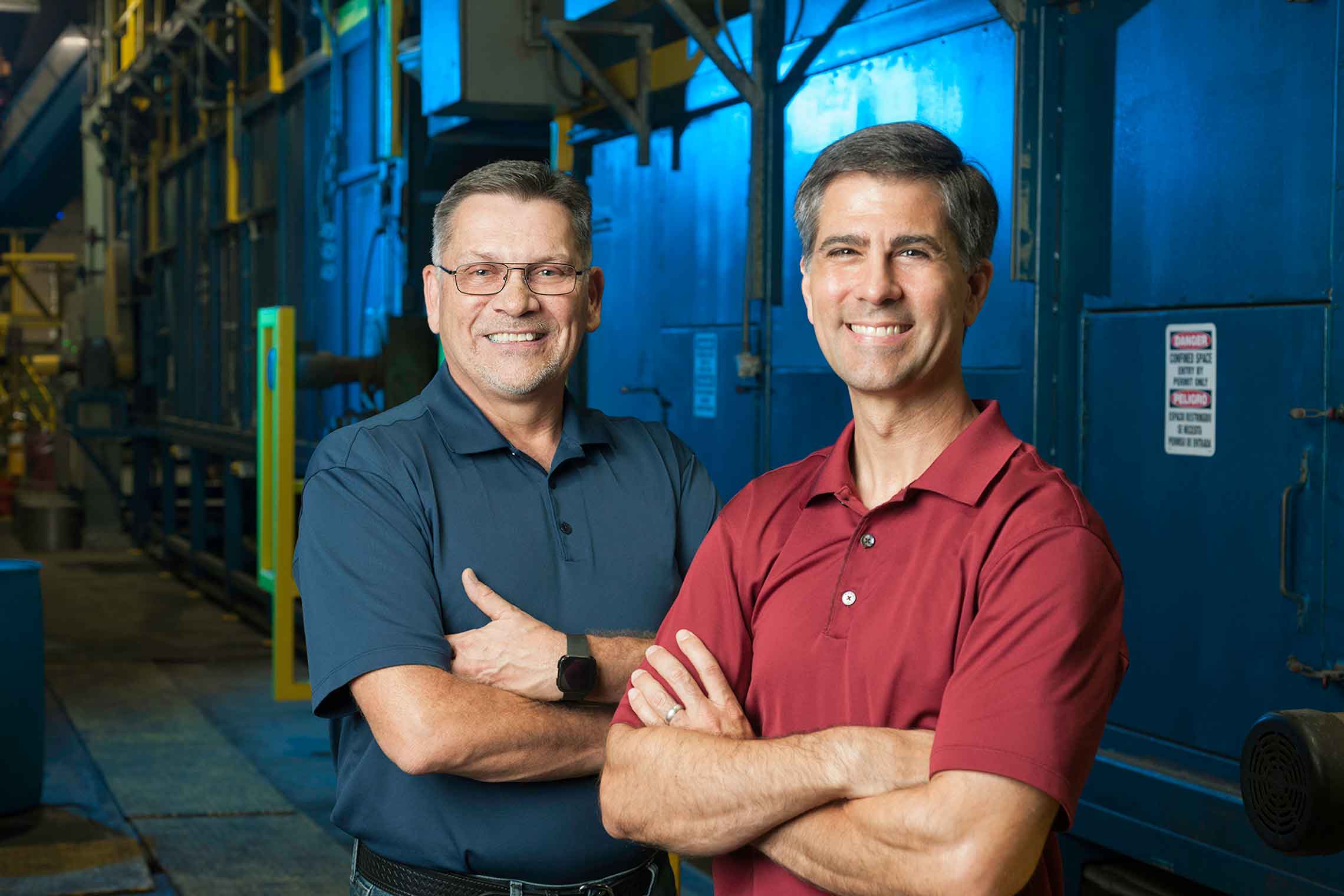 DIFCO V.P.s Alan Morton (left) and Chrish Henderson (right) stand in their shop next to the large-capacity GEOMET coating equipment.